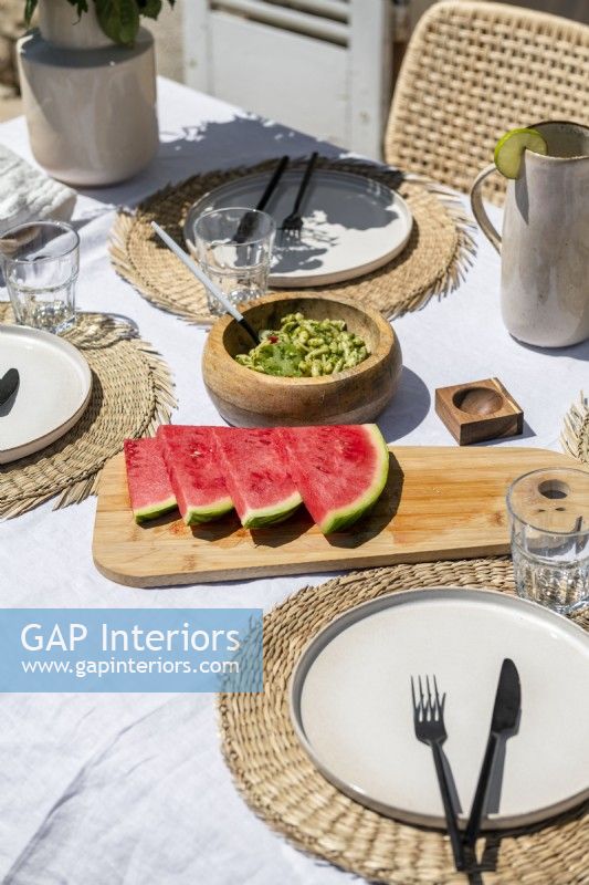 Detail of watermelon on outdoor dining table in summer