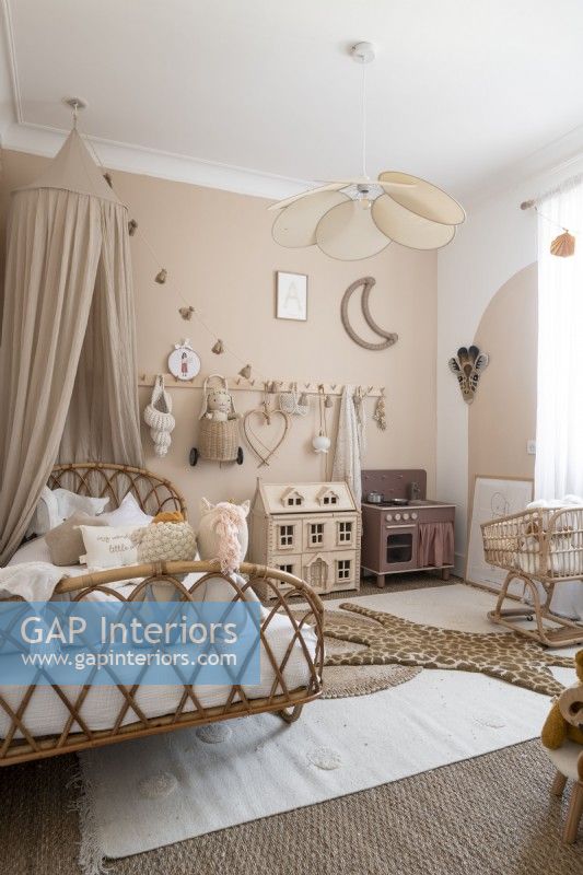 Wicker bed frame and canopy in modern childrens bedroom
