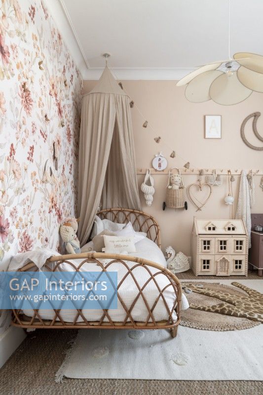 Cane bedframe in childs bedroom with canopy
