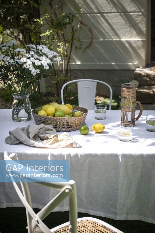 Country outdoor dining table with tablecloth