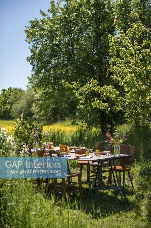 Outdoor dining table in country garden