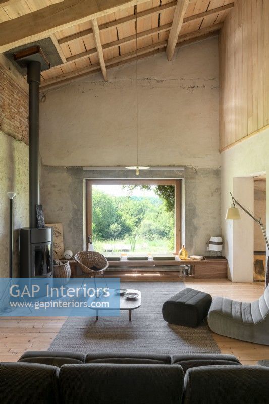 Contemporary furniture in coverted country barn living room