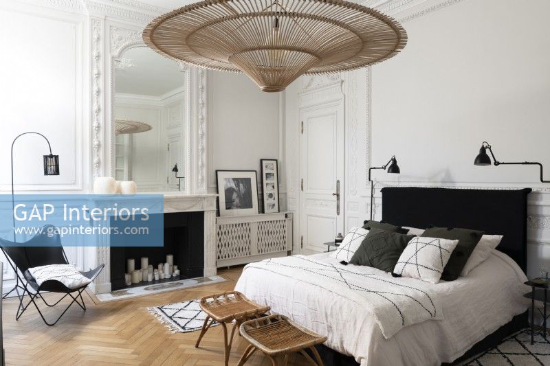 Large wicker lampshade in modern monochrome bedroom