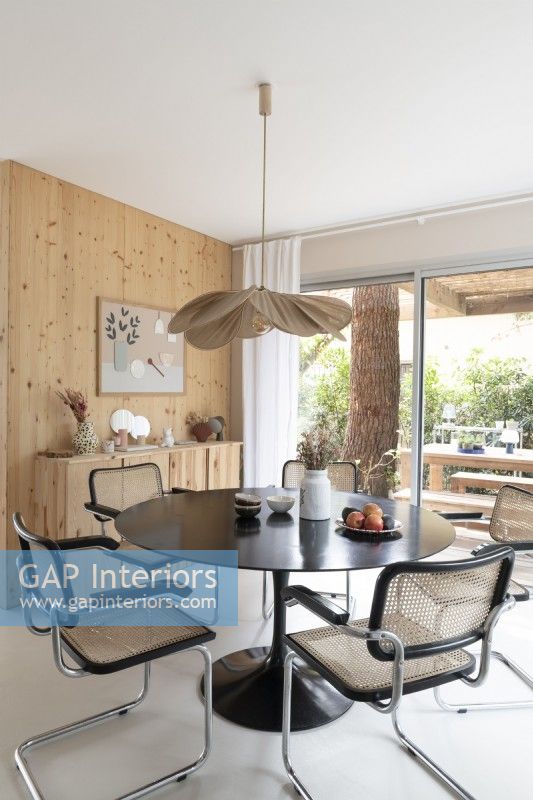 Modern dining room with view to outdoor dining area