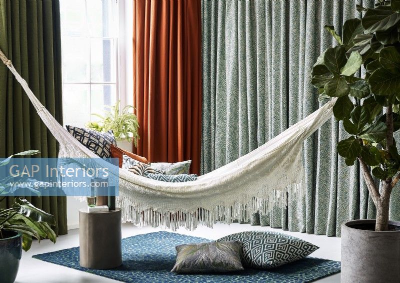 Hammock in contemporary living room with curtains
