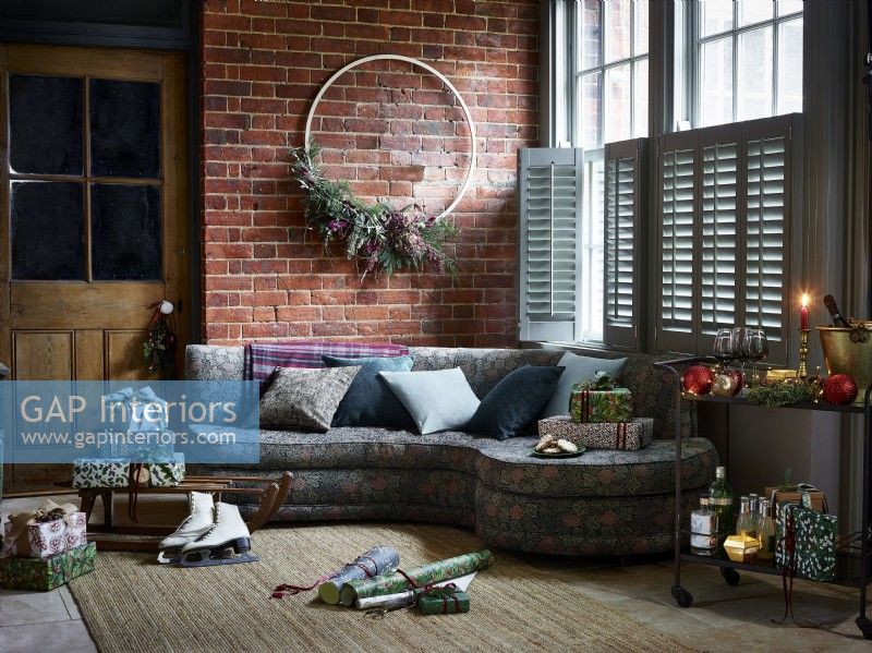 Christmas Living room with large wreath, gifts and shutters cracked open