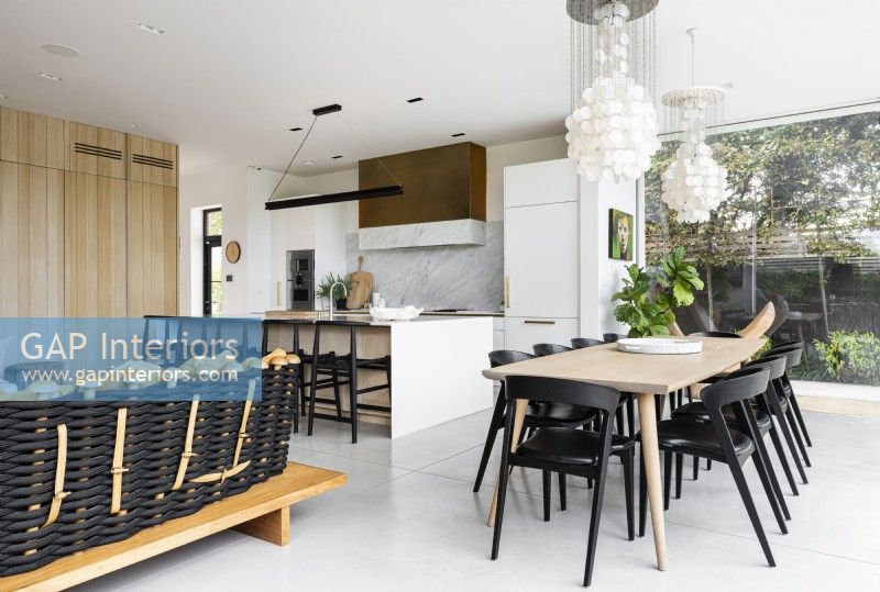 Modern classic kitchen with island and dining table.