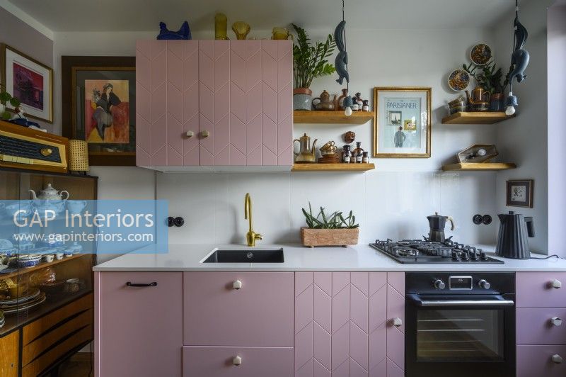 Modern kitchen with dusky pink cabinets