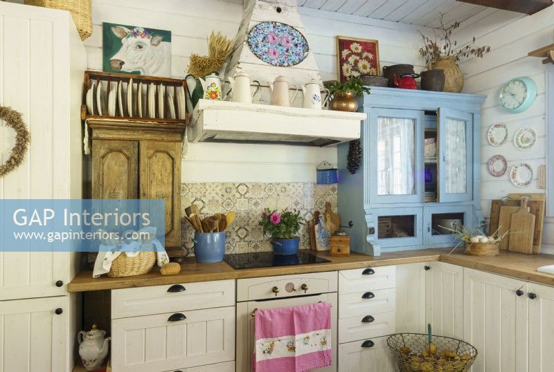 Country kitchen with a blue reclaimed cupboard