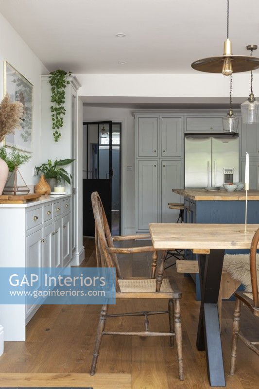 Open plan grey and blue shaker style kitchen dining room