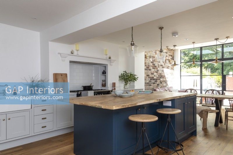 Shaker style blue and grey open plan kitchen dining room