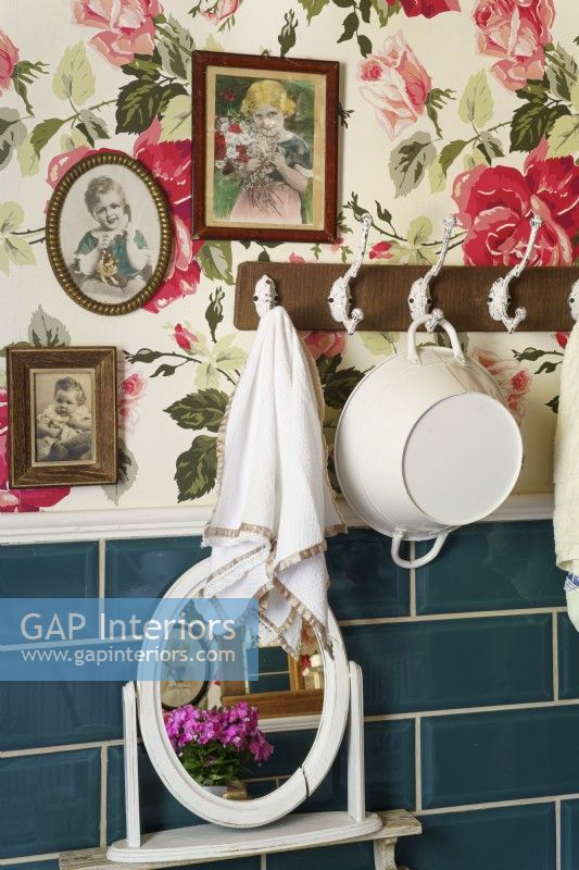Rose patterned wallpaper in country bathroom