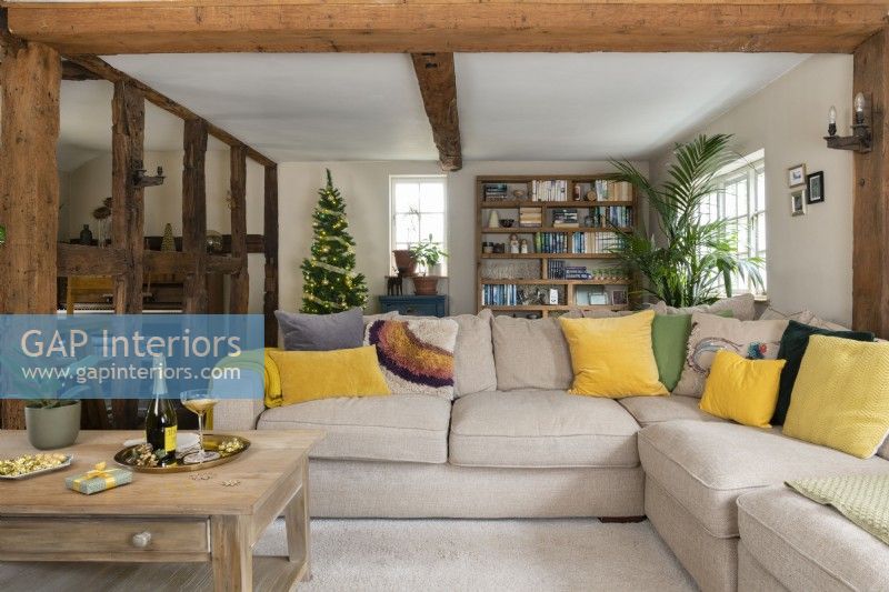 Spacious country living room with exposed wood beams