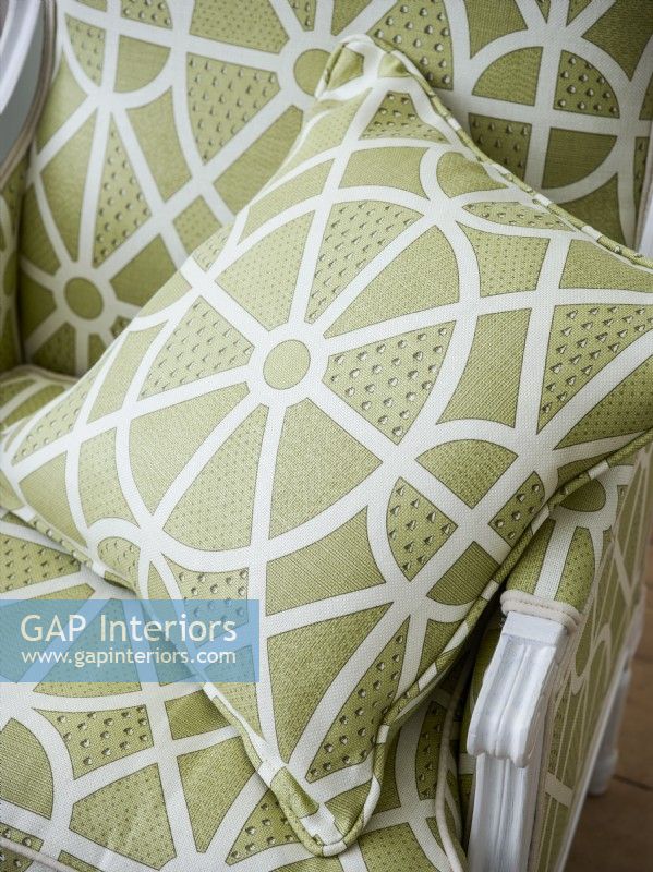 Green patterned cushion on classic chair