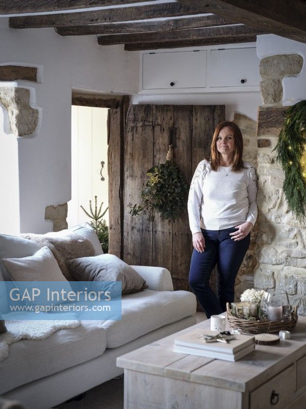 Portrait of homeowner Gayle Scott in living room 