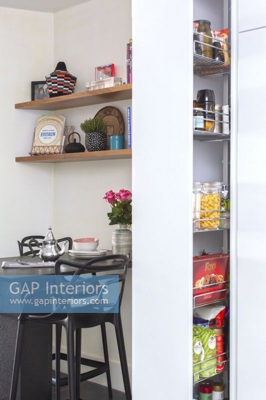 Integrated sliding pantry cabinet and breakfast bar