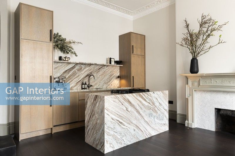 Contemporary kitchen with marble island.