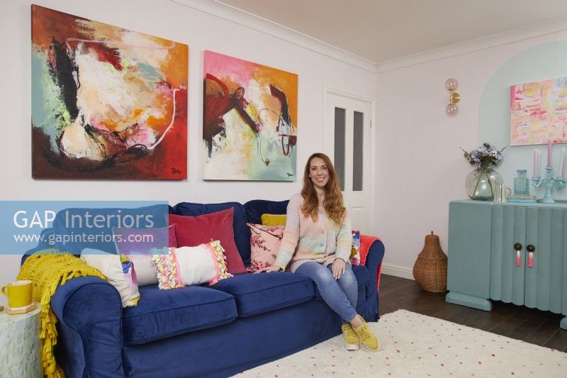 Woman in a colourful living room.