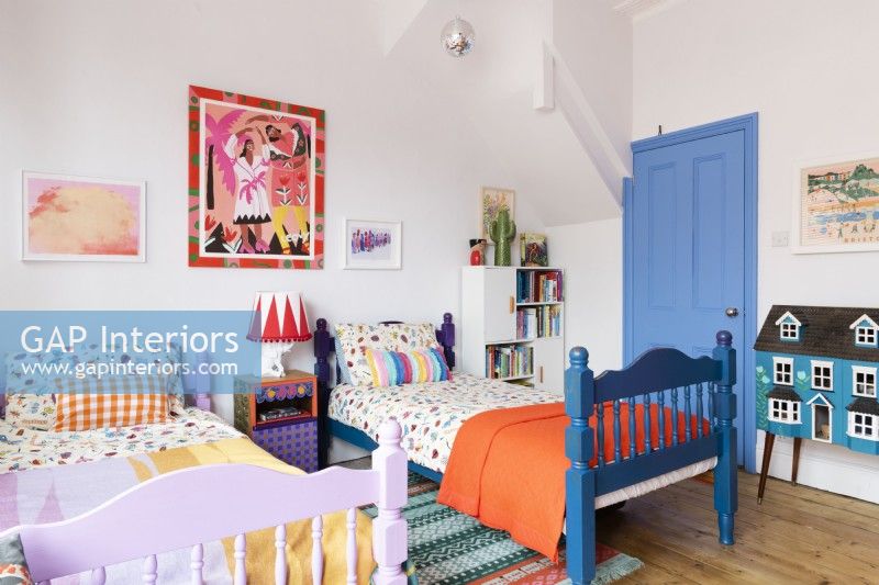 Twin beds in a colourful childrens bedroom