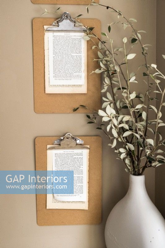 Extract pages of text displayed on wall mounted clipboards - detail