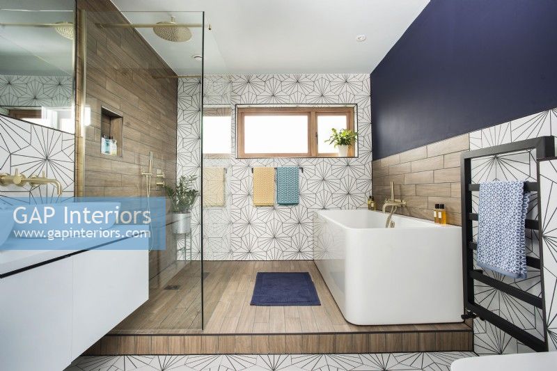 Modern bathroom with patterned floor and wall tiles
