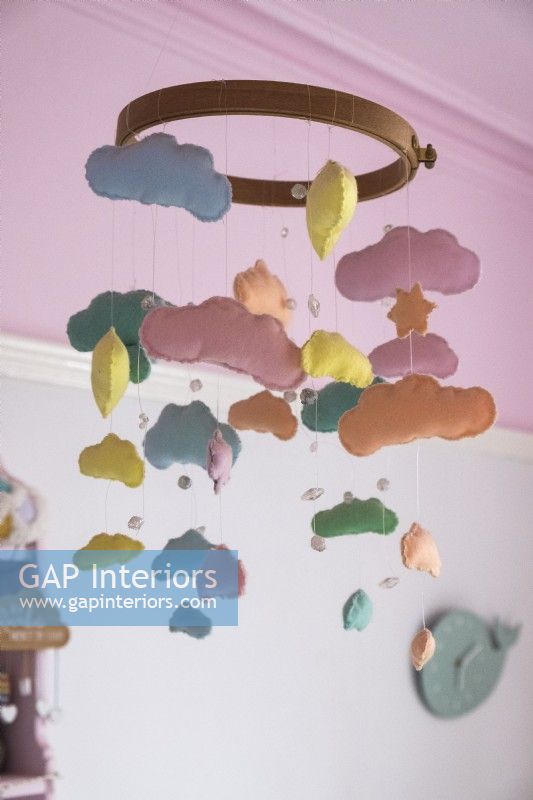 Colourful fabric cloud mobile in childrens room - detail