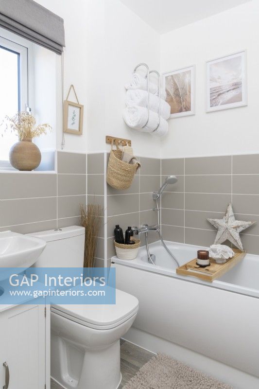 Compact modern bathroom with grey tiled splashback