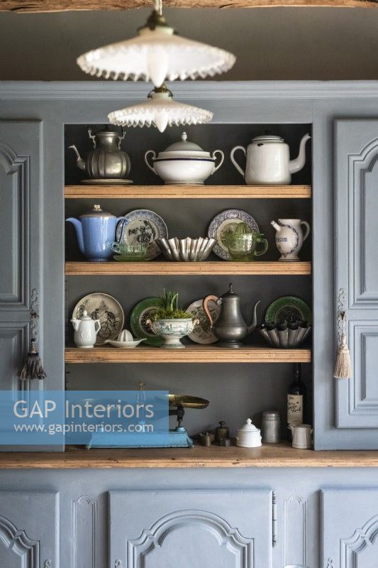Grey painted wooden dresser with vintage crockery and accessories