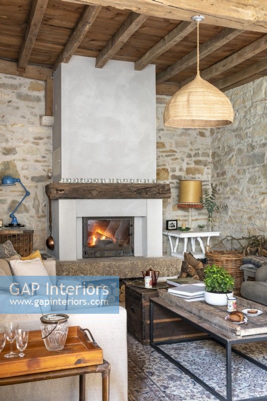 Lit fire in cosy country living room