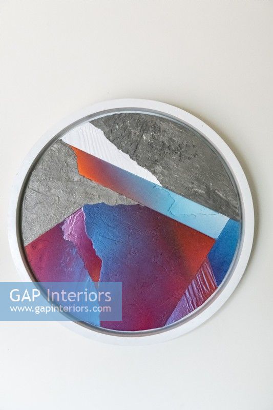 Detail of colourful artwork in circular frame