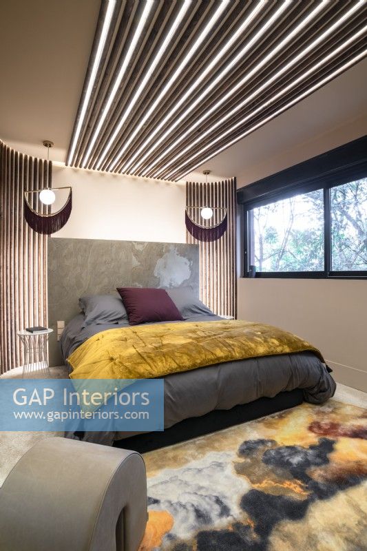 Contemporary bedroom with modern lighting design