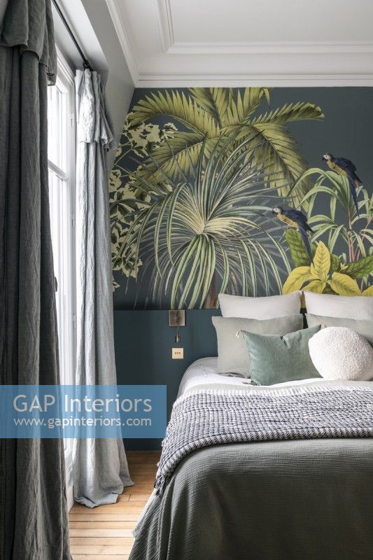 Tropical scene on feature wall in classic style bedroom