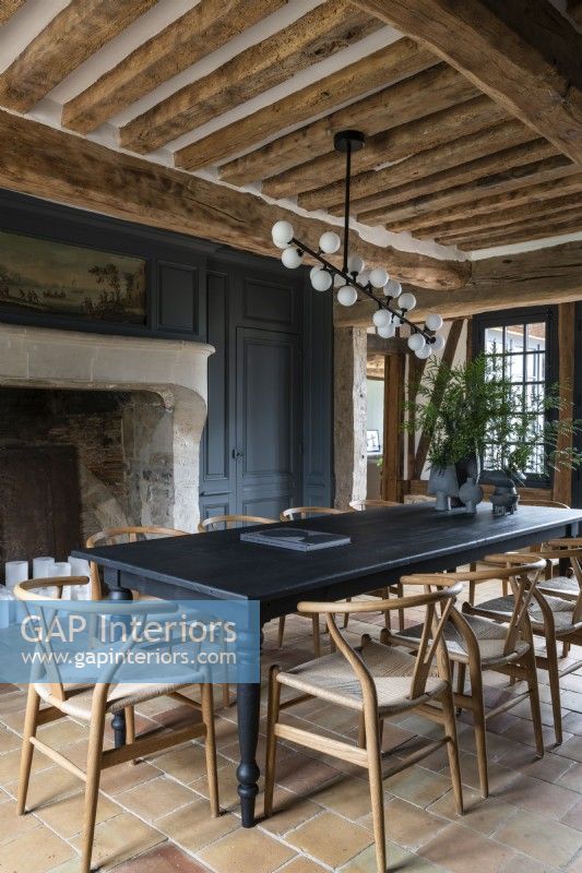Black painted dining table in country dining room 