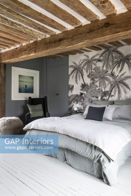 Grey and white modern country bedroom with tropical feature wall