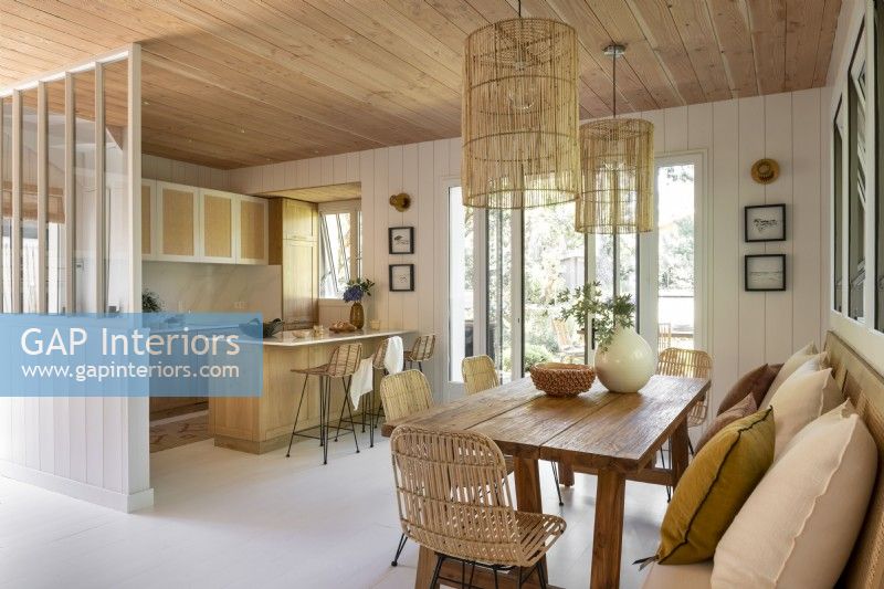 Open plan kitchen-diner in modern wooden cabin