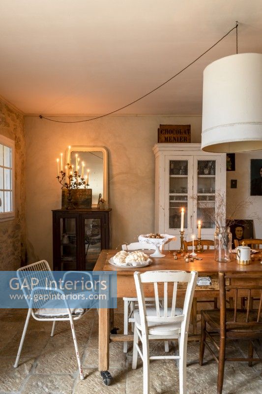 Country dining room with lit candles 