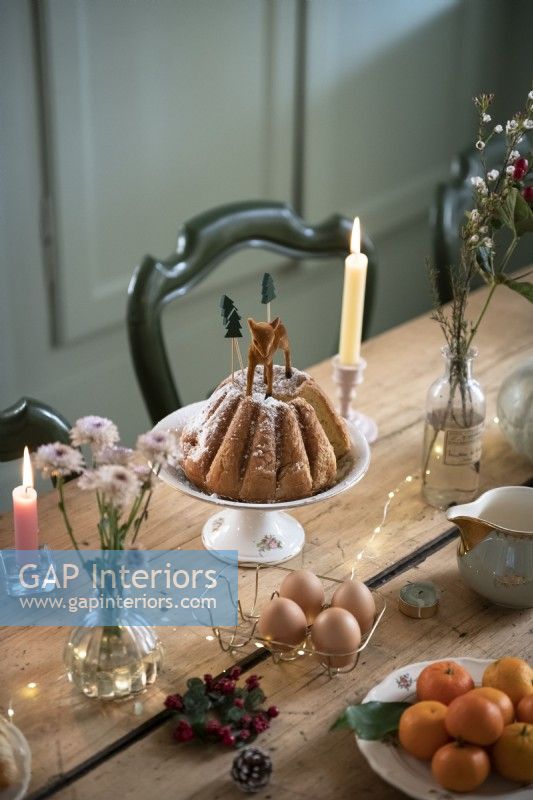 Cake on stand on country dining table - detail