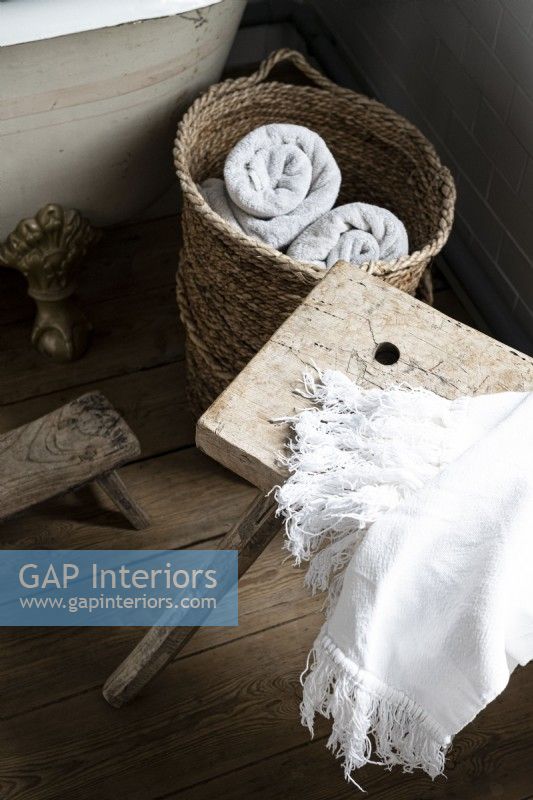 Bathroom towels in rustic basket