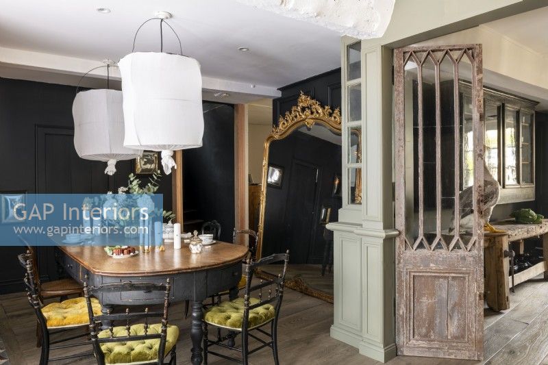 Distressed wooden internal door in classic style dining room