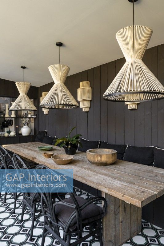 Modern country dining room with sisal string lampshades over table