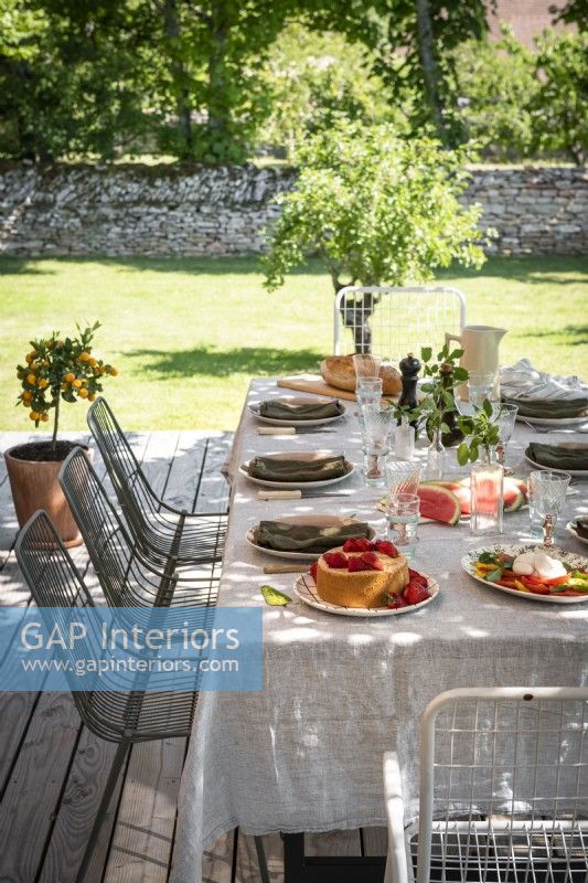 Exterior country dining table on veranda in summer