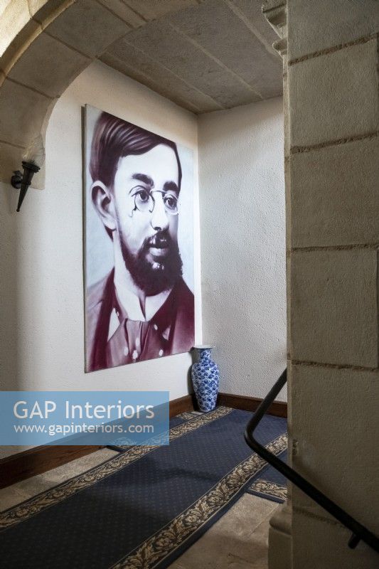 Large portrait of Toulouse Lautrec in classic hallway