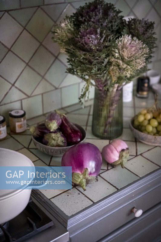 Vegetables and flowers on kitchen worktop - detail