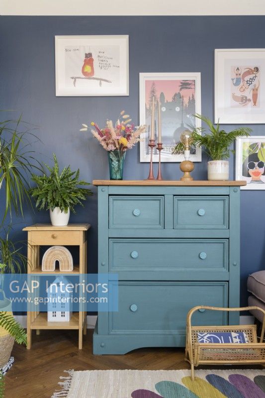Green chest of drawers in a blue living room