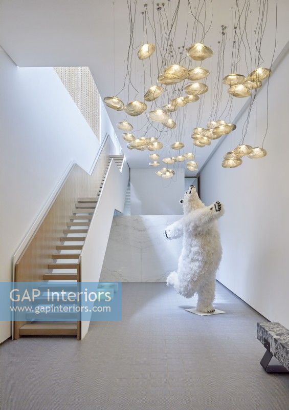 Polar bear sculpture in contemporary hallway
