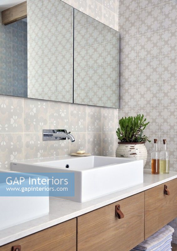 Modern double sink unit  with patterned tiled walls