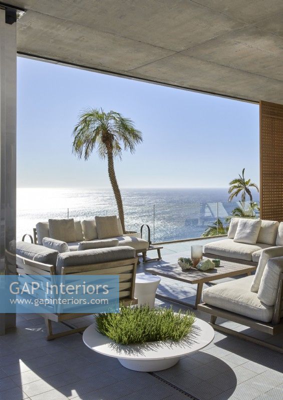 Covered outdoor living area with coastal views