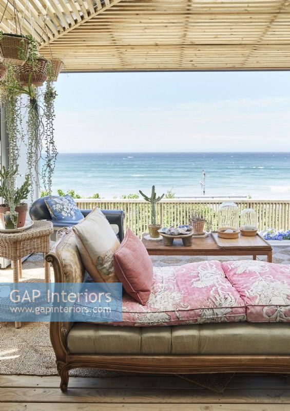 Antique daybed on terrace with sea views