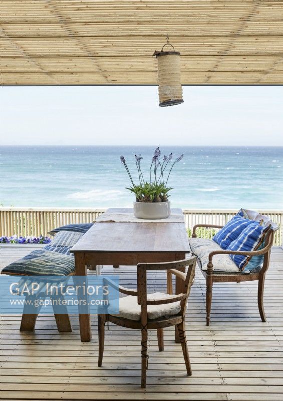 Outdoor dining table with sea views from terrace