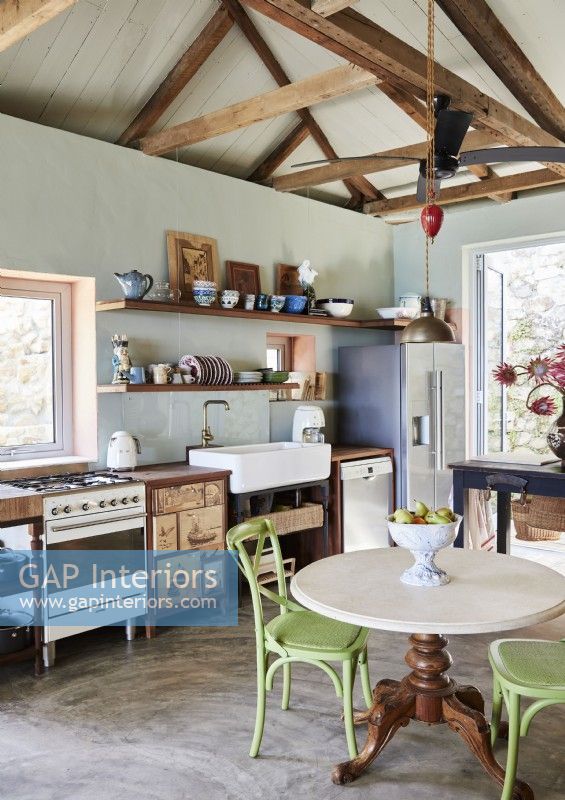 Small circular table in country kitchen-diner